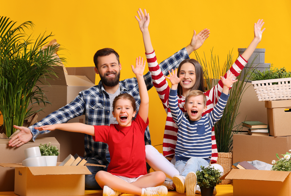 Excited family celebrating relocation to new house
