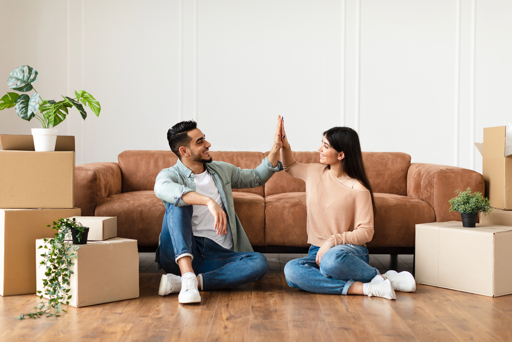 Happy man and woman giving high five